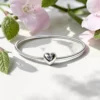 bracciale rigido con chiusura a cuore